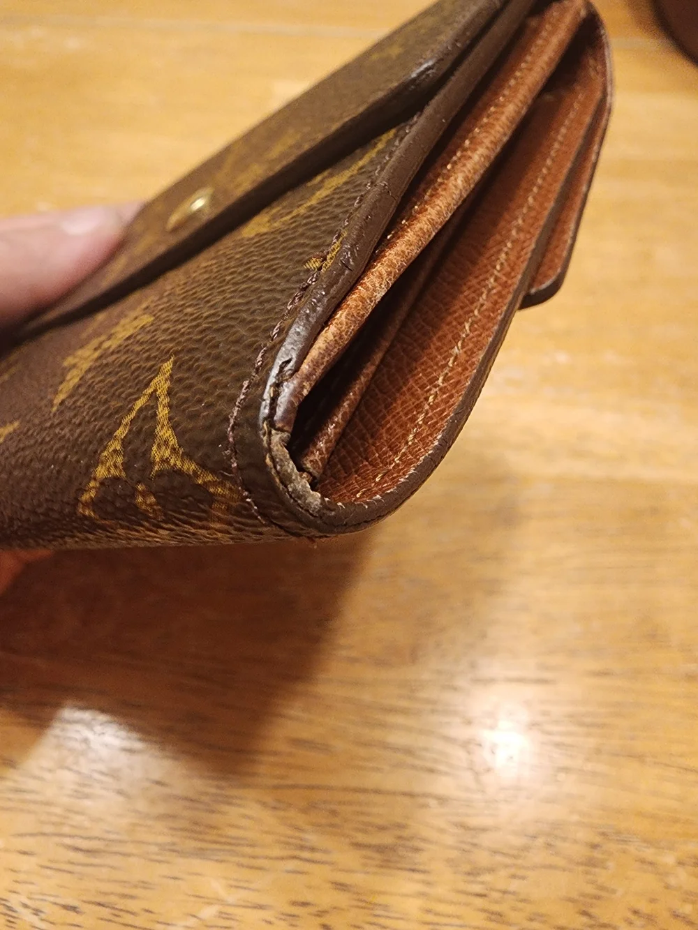 vintage Louis Vuitton Monogram Elise Wallet crafted in the classic brown LV